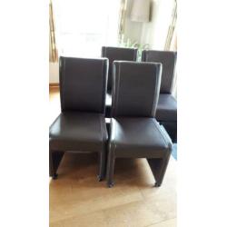 4 nette eetkamerstoelen kunstleder met wieltjes