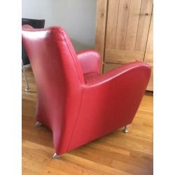 Mooie rood leren fauteuil.